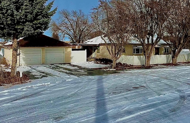 view of front of home with driveway and an attached garage