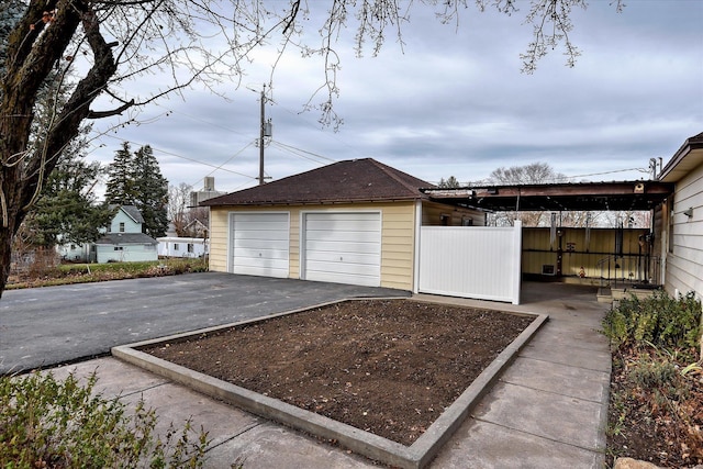 detached garage with fence