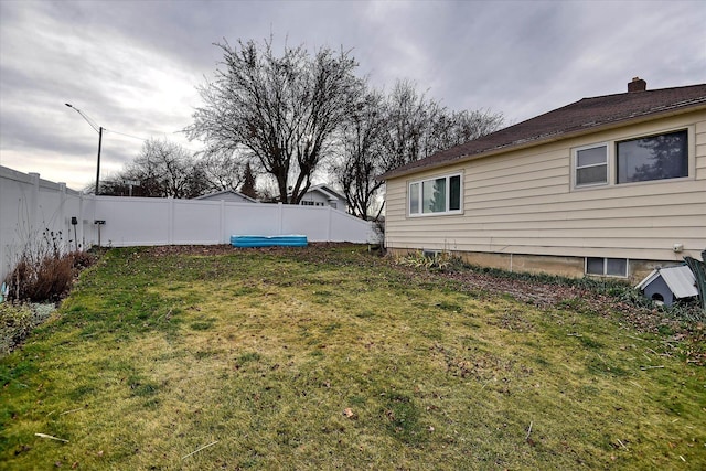 view of yard featuring a fenced backyard