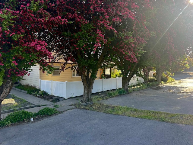 view of side of property featuring fence