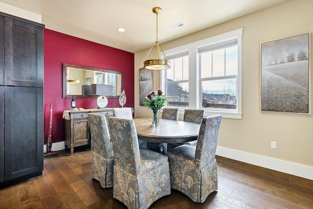 dining area with dark wood-style floors, recessed lighting, visible vents, and baseboards