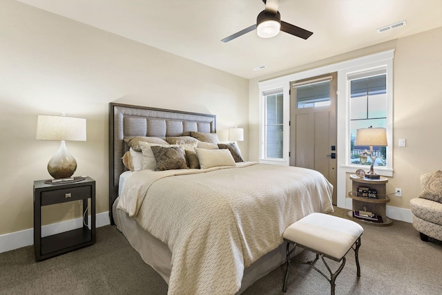 bedroom featuring baseboards, visible vents, ceiling fan, and carpet flooring