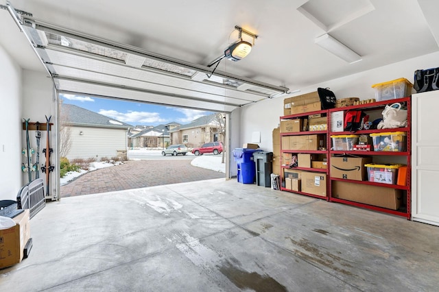 garage with a residential view and a garage door opener