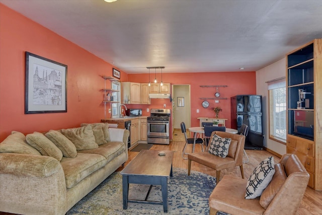 living room with light wood-style floors and baseboards