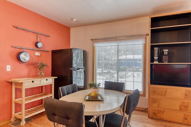 dining room featuring light wood finished floors