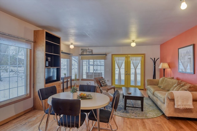 dining room featuring french doors and light wood-style flooring