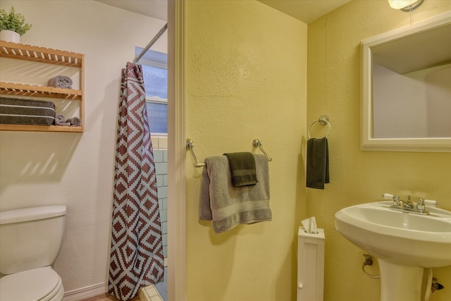 full bathroom with a sink and toilet