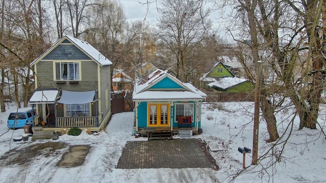 view of front of home with french doors and covered porch