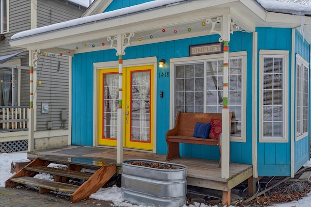 doorway to property featuring board and batten siding