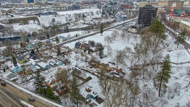 snowy aerial view with a view of city