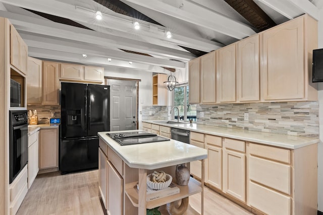 kitchen featuring open shelves, a sink, light countertops, light brown cabinetry, and black appliances