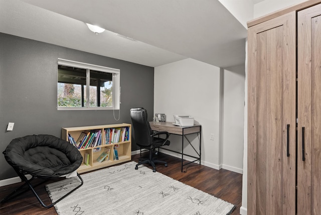 home office featuring baseboards and dark wood-type flooring