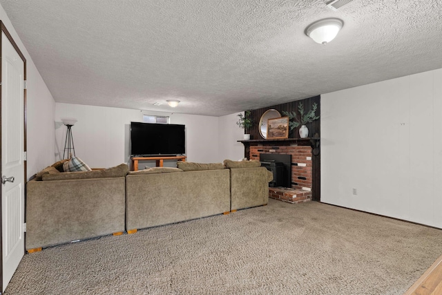 carpeted living room featuring a textured ceiling