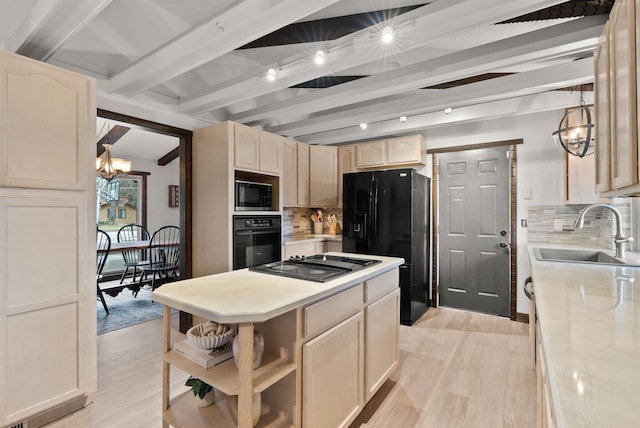 kitchen featuring a sink, light countertops, black appliances, open shelves, and a notable chandelier