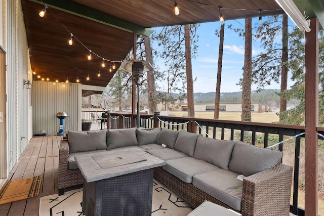 wooden deck with an outdoor living space