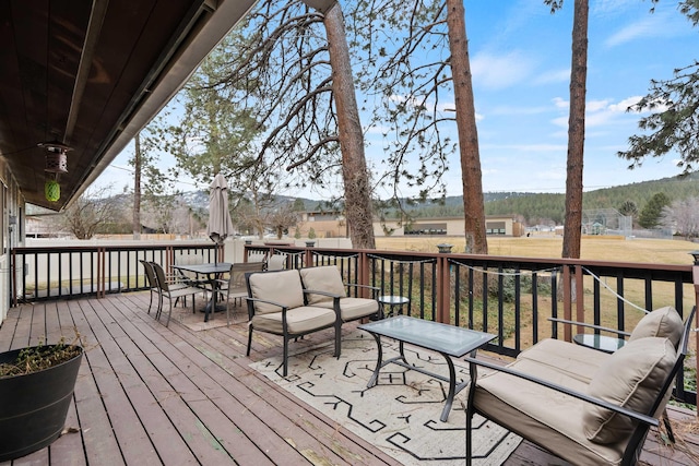 wooden deck featuring an outdoor living space and outdoor dining space