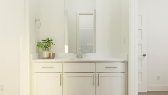 bathroom featuring vanity and baseboards