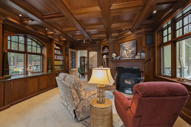 sitting room featuring light carpet, wood walls, wooden ceiling, coffered ceiling, and beamed ceiling