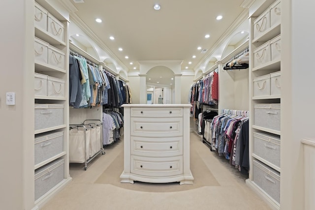 walk in closet with arched walkways