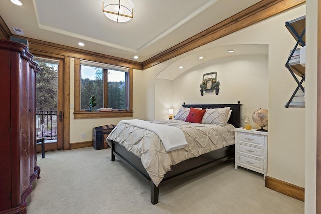 bedroom featuring baseboards, light colored carpet, access to exterior, a tray ceiling, and recessed lighting