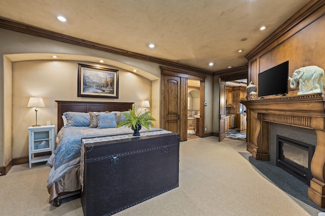 bedroom with arched walkways, light colored carpet, ornamental molding, a fireplace with flush hearth, and baseboards