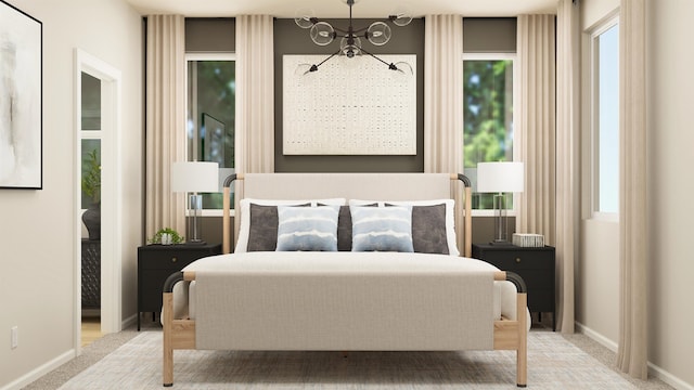 carpeted bedroom with baseboards