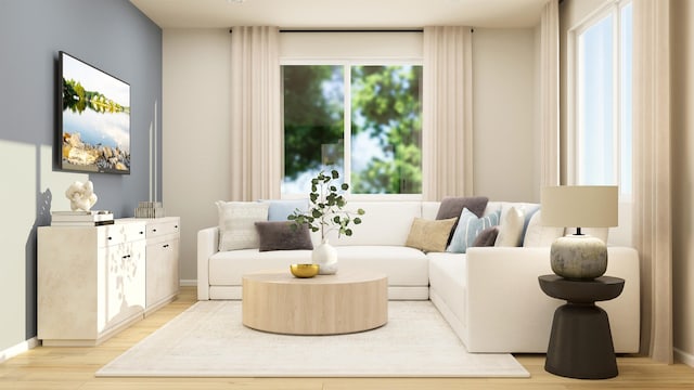 sitting room featuring light wood finished floors and baseboards