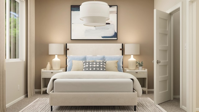 bedroom featuring light carpet and baseboards