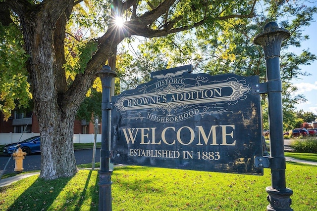 community / neighborhood sign with a lawn