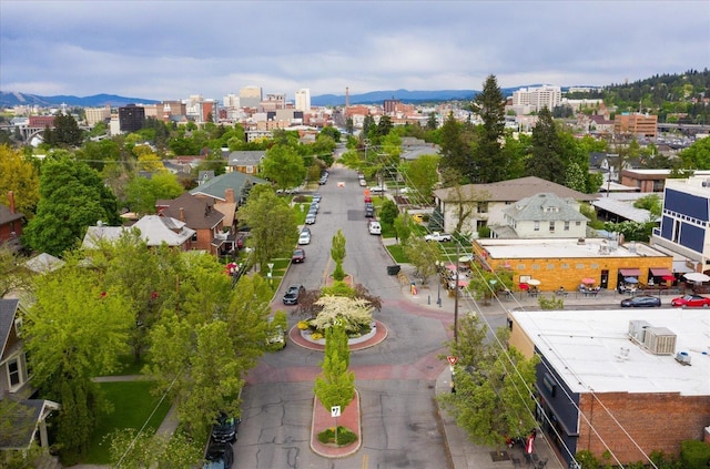 birds eye view of property featuring a view of city and a mountain view