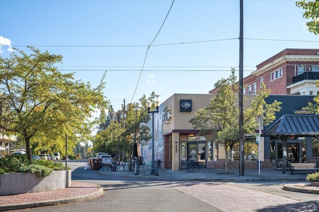 view of road with sidewalks and curbs