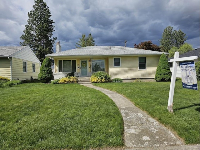 328 W Nebraska Ave, Spokane, WA 99205 - view of front of home featuring a front lawn and a chimney