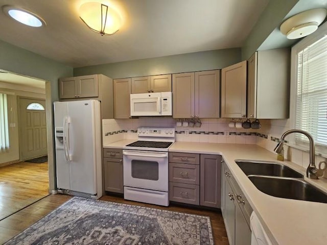 328 W Nebraska Ave, Spokane, WA 99205 - kitchen with white appliances, a sink, dark wood-type flooring, and decorative backsplash