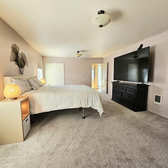 bedroom with visible vents and light colored carpet