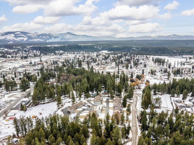 snowy aerial view with a mountain view