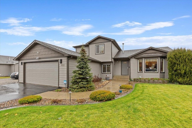 view of front of home with a garage, aphalt driveway, and a front lawn