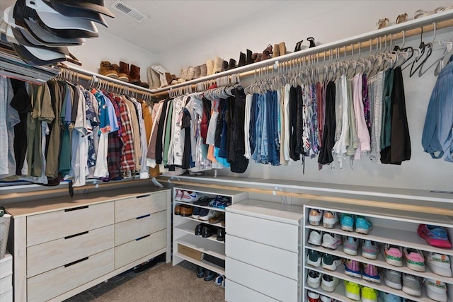 spacious closet featuring visible vents and carpet flooring