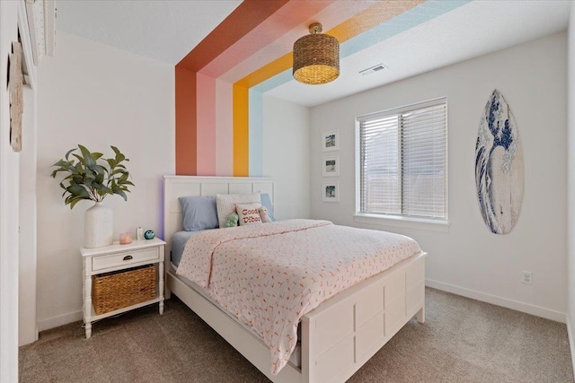 bedroom with carpet floors, visible vents, and baseboards