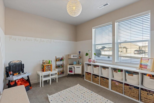 playroom with visible vents and carpet flooring