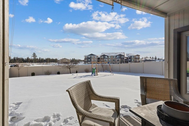 view of patio with fence and a residential view