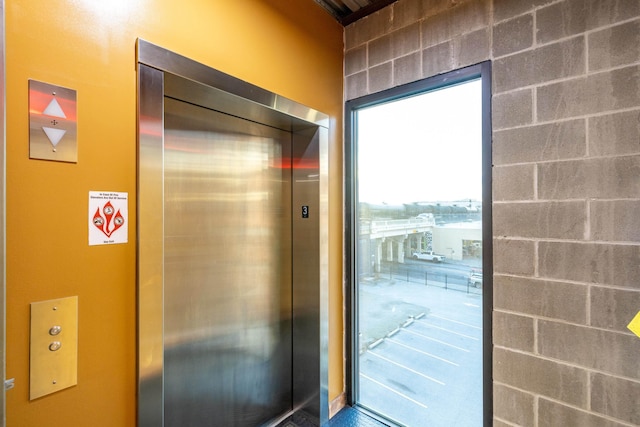 doorway to outside with elevator