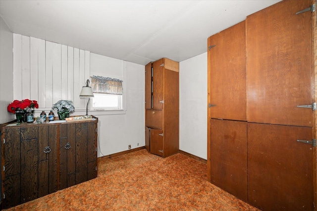 bedroom featuring baseboards