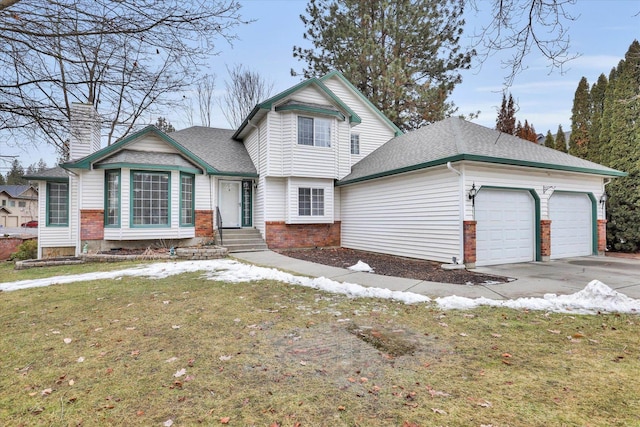 view of front facade with a garage, a front yard, brick siding, and driveway