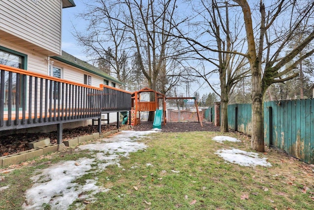 view of yard featuring a playground and a fenced backyard