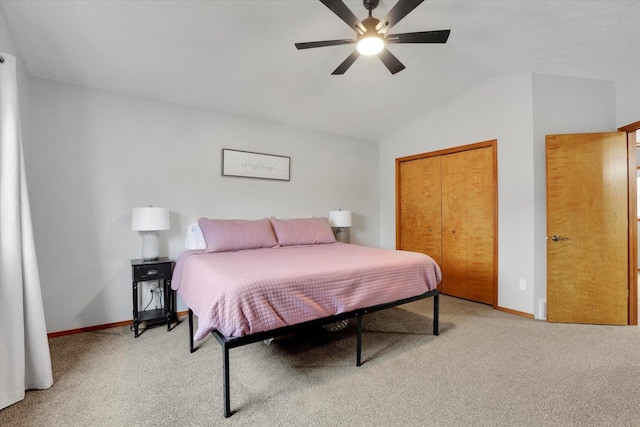 bedroom featuring vaulted ceiling, baseboards, and light colored carpet