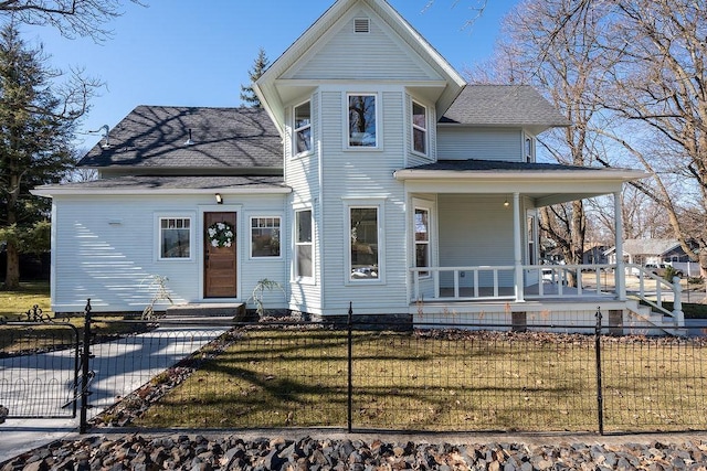 victorian home featuring a fenced front yard, a porch, a shingled roof, a front yard, and a gate