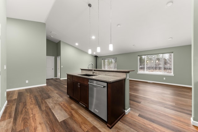 kitchen featuring dark wood-style flooring, a sink, dark brown cabinets, stainless steel dishwasher, and decorative light fixtures