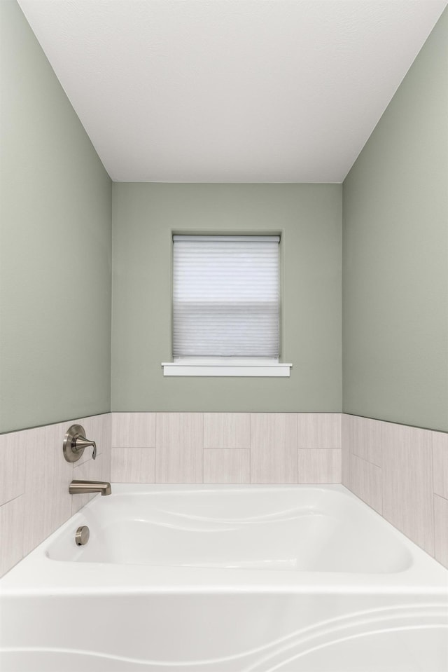 bathroom with a garden tub