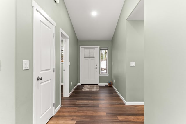 foyer entrance featuring wood finished floors and baseboards