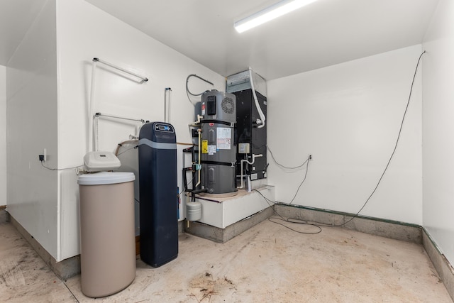 utility room featuring heat pump water heater